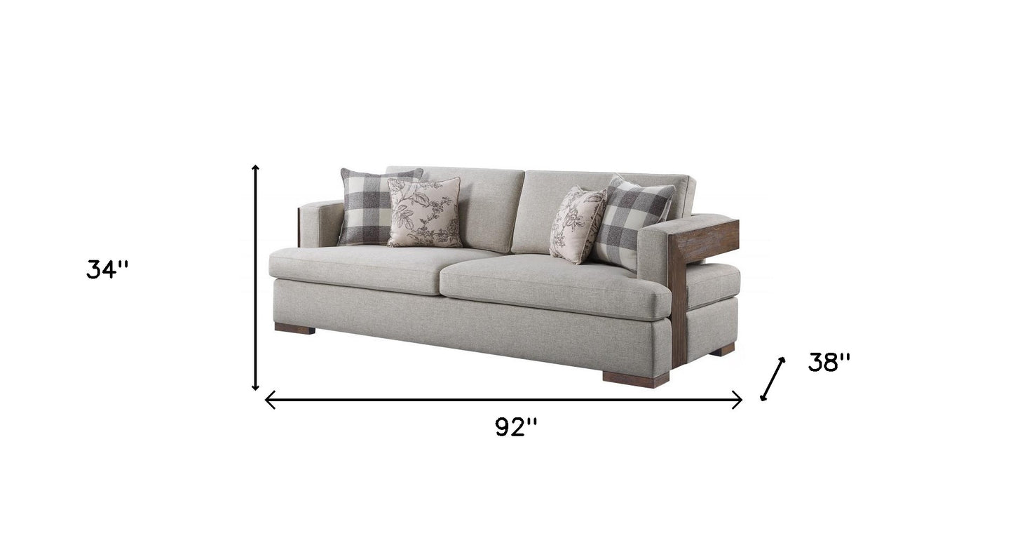 Fabric Sofa and Toss Pillows with Brown Legs